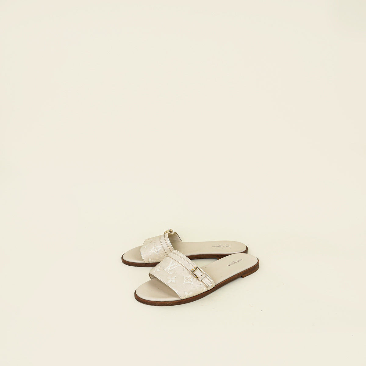 Louis Vuitton Cream Monogram Empreinte Lockit Flat Mules 38.5